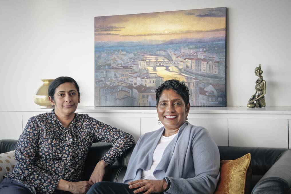 Artists Shija Mathew and Alice Kaushal excited for their exhibition Trapped and Free. Mathew's work features in the background. Pictures: Craig George
