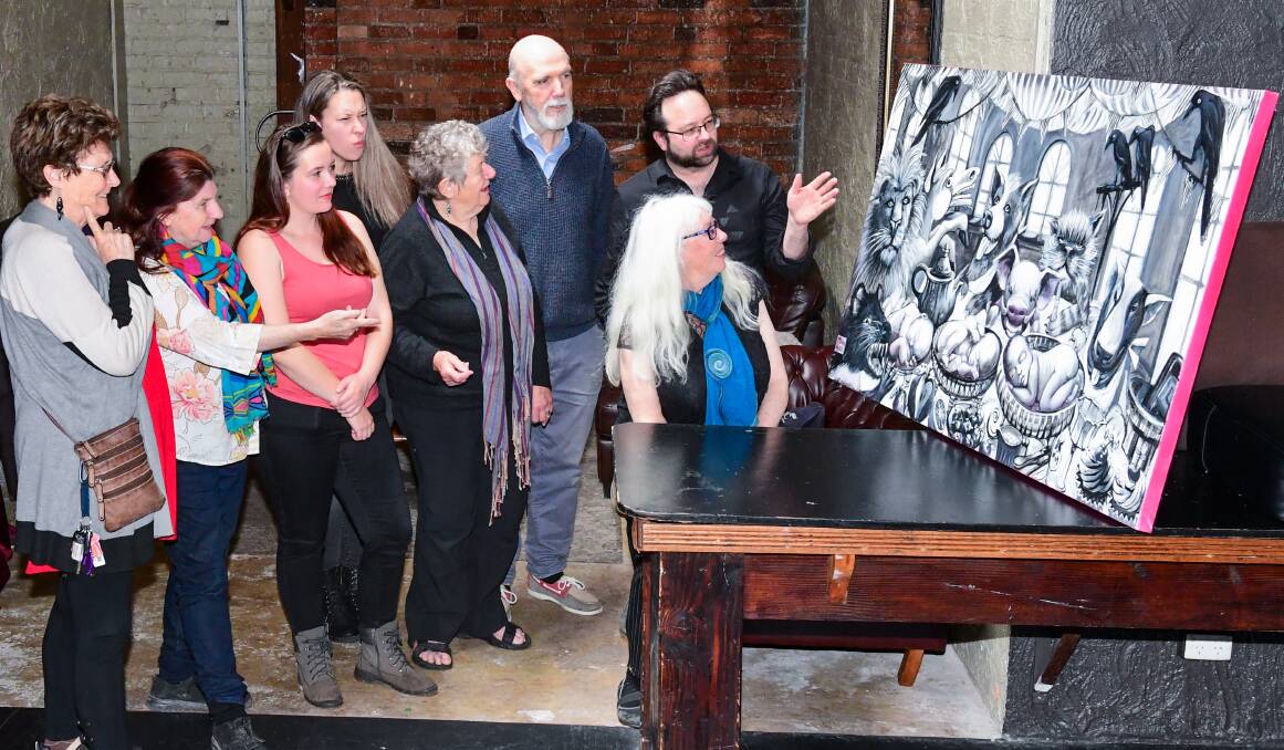 Marilyn Arnold, Yvonne Gluyas, Rebecca Young, Louise Arnold, Joy Elizabeth, Colin Berry, Chris Rattray, and Evie Wood admire Catriona MacLaine's work. Picture: Neil Richardson. 