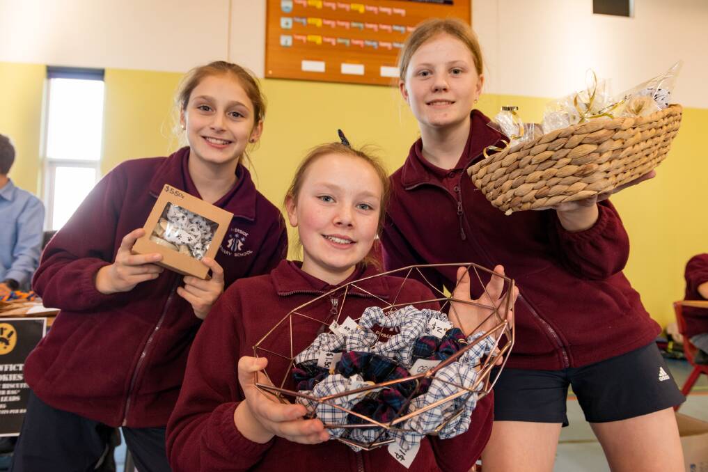 Riverside Primary School students Amelia Holmes, Olive Nicholson, and Alanah Bailey at the Makers' Market. Picture: Phillip Biggs 