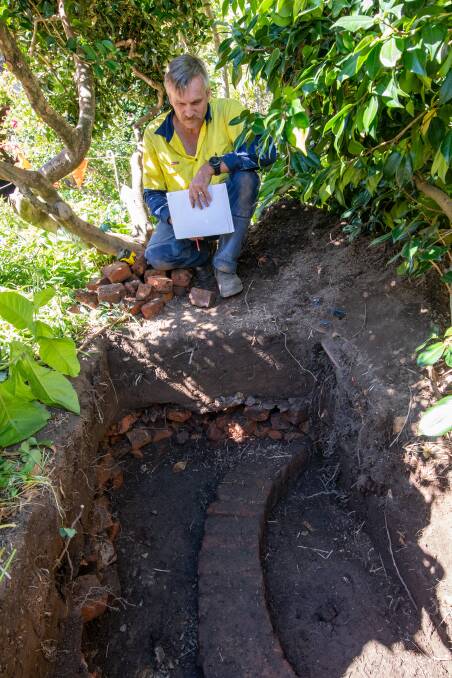 Franklin House's Darren Watton with the old well found in the garden.