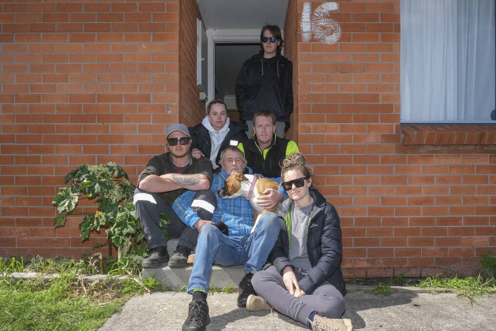 Family and friends of Austin Giles at the family home in George Town. Picture: Craig George 