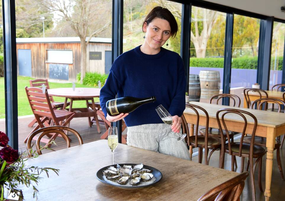 Bec Jones with wine and oysters at Tamar Ridge. Picture: Neil Richardson