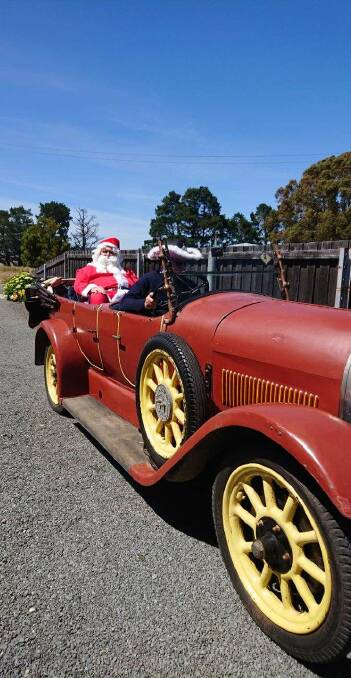 Santa visited kids at the Rossarden Kids Christmas Club party in a 1925 French made Lorrane-Dietrich. Picture: supplied 