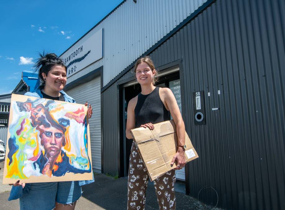 Sawtooth director Zara Sully, holding Ella Boas' work, with gallery assistant Lauren Neal. Picture: Paul Scambler
