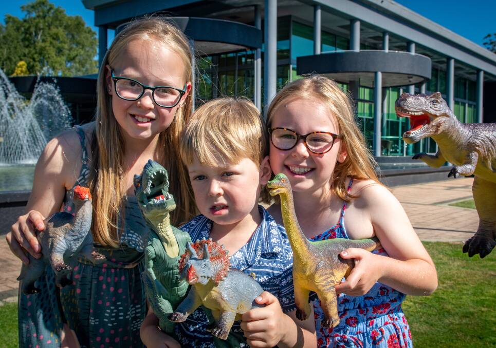 Charlotte Plaisted, 10, George Plaisted, 6, and Amelia Plaisted, 8, of Launceston, excited for when the Jurassic Creatures interactive life-like exhibition arrives. Picture: Paul Scambler 