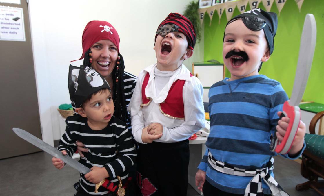 Ethan, 3, Montessori staff member Linda Forbes, Karim, 4, and Bear, 4, on National Pirate Day in 2016. Picture: Supplied