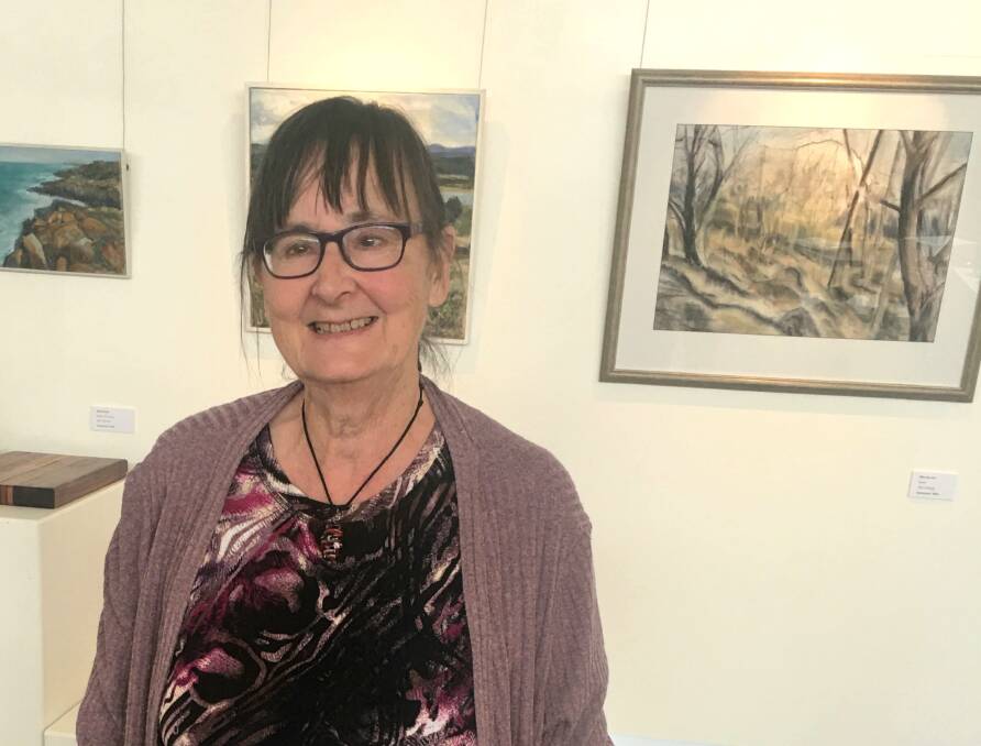 Edna Broad with her exhibition at Scottsdale Art Gallery. Picture: Supplied