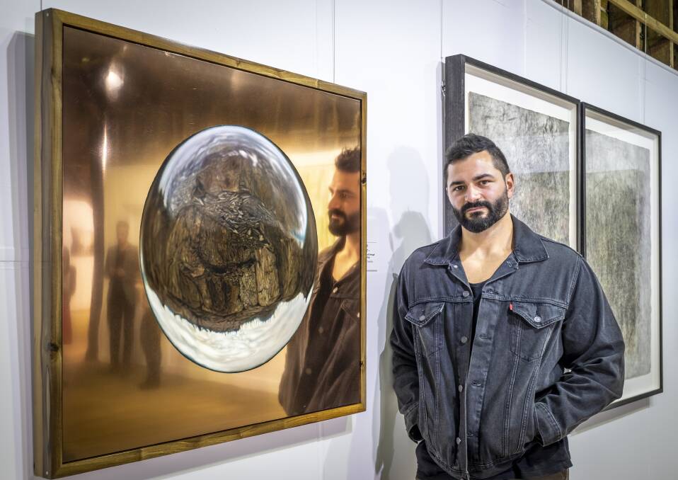Winner of the 2021 Glover Prize Sebastian Galloway, of Hobart, with his winning piece. Picture: Craig George