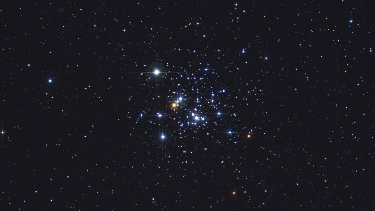 A close-up view of the Jewel Box cluster. Several very bright, pale blue supergiant stars, a solitary ruby-red supergiant and a variety of other brilliantly coloured stars are visible, as well as many much fainter ones. Picture: Shutterstock