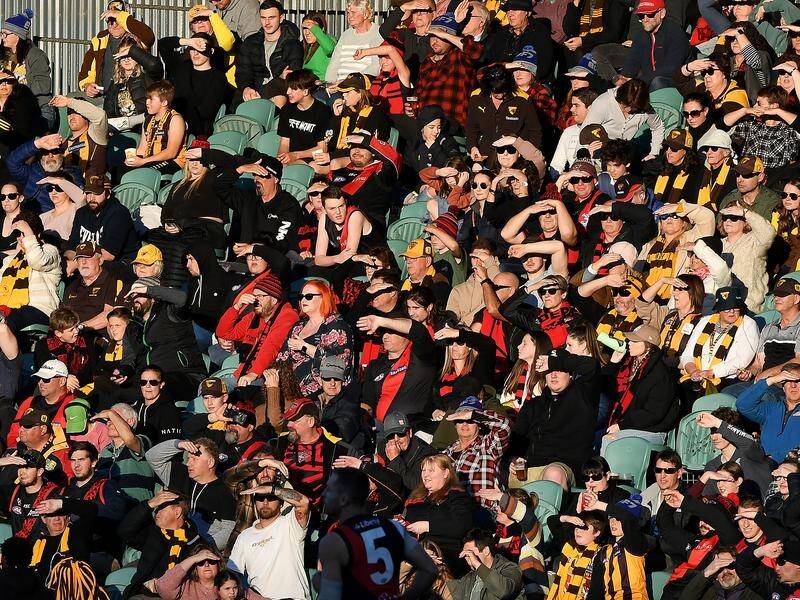 A crowd of more than 14,000 turned for the AFL match between Hawthorn and Essendon in Launceston.