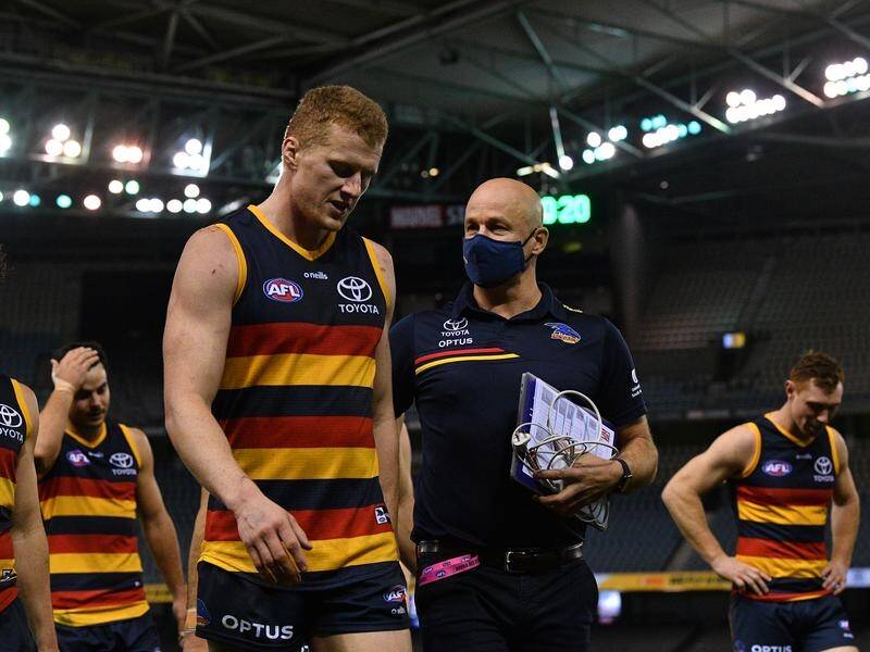 Reilly O'Brien with coach Matthew Nicks after Adelaide's win over Hawthorn in the AFL.