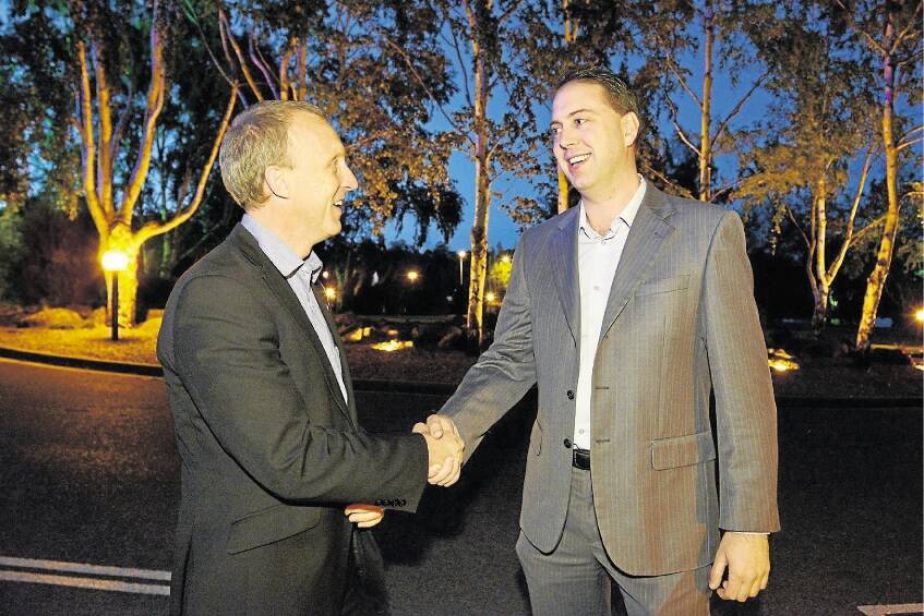 Incumbent Meander Valley Mayor Craig Perkins is congratulated by challenger Andrew Connors. Picture: SCOTT GELSTON