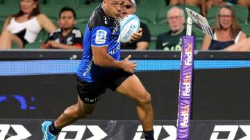 Chase Tiatia goes over for a try in Western Force's hammering by the Hurricanes. (Richard Wainwright/AAP PHOTOS)