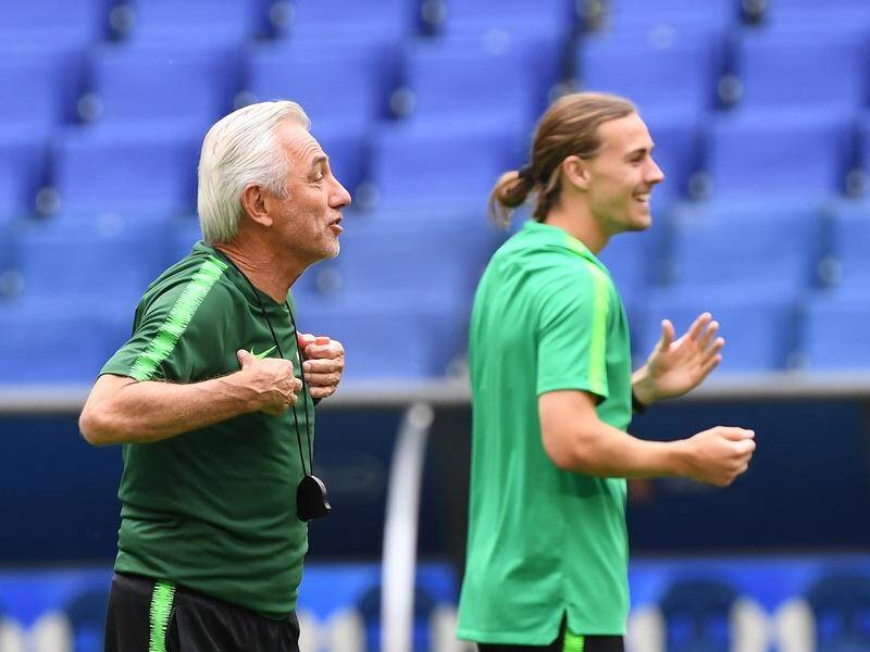 Socceroos coach Bert van Marwijk goes through the paces with his side ahead of the Denmark match.