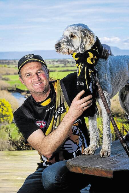 Friday September 5 2014  photo:  Phillip Biggs  report:  Alex FairRichmond fan Grant Archer of Longford, pictured with his dog Magic, is heading off to Adelaide with his family to watch his team play (the dog isn't)