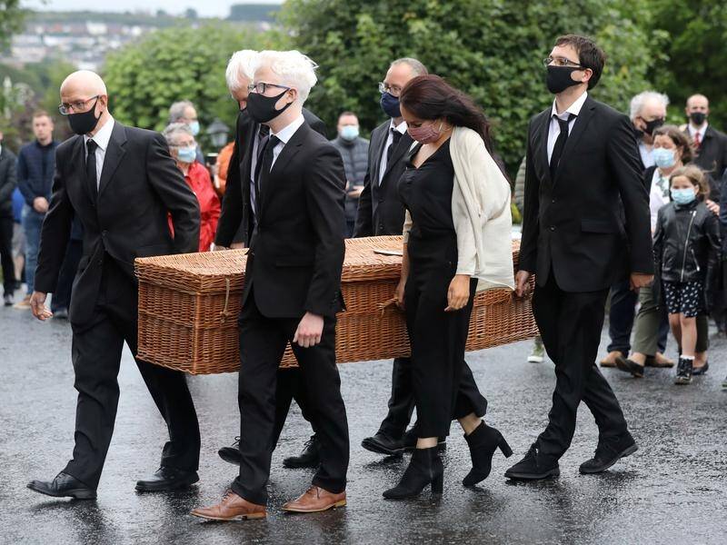 John Hume's coffin is carried into St Eugene's Cathedral in Derry, Northern Ireland.