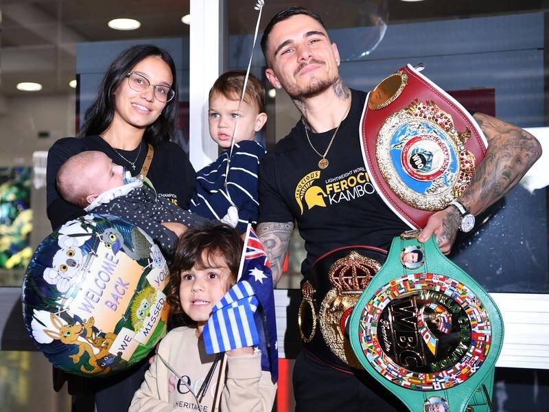 George Kambosos has returned home to a hero's welcome after winning three boxing world titles.