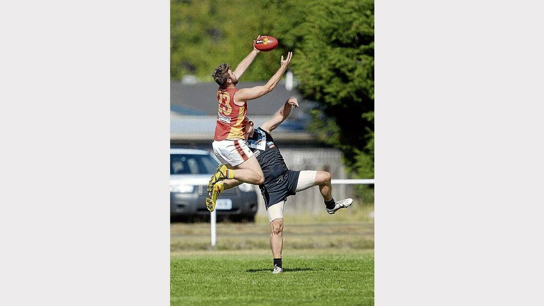 Meander Valley's William Shipp gets the jump on Perth's Peter Lucas to pull down a strong mark in yesterday's opening round clash. Picture: MARK JESSER