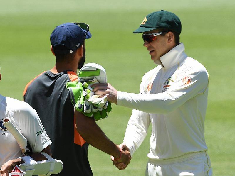 Rival captains Tim Paine (r) and Virat Kohli shake hands after the second Test in Perth.