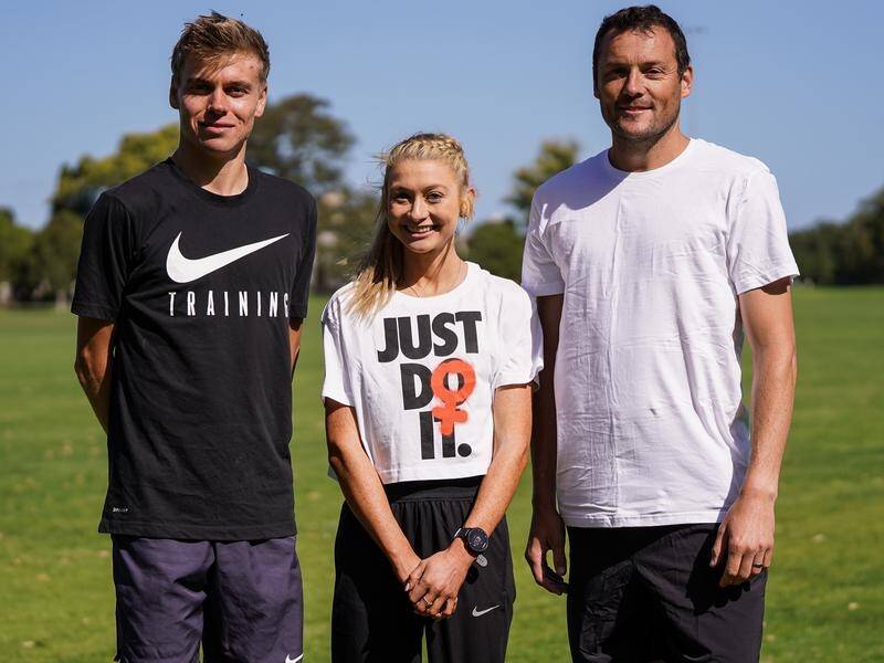Australian athletes Stewart McSweyn and Jessica Hull with retired runner Craig Mottram in Melbourne.