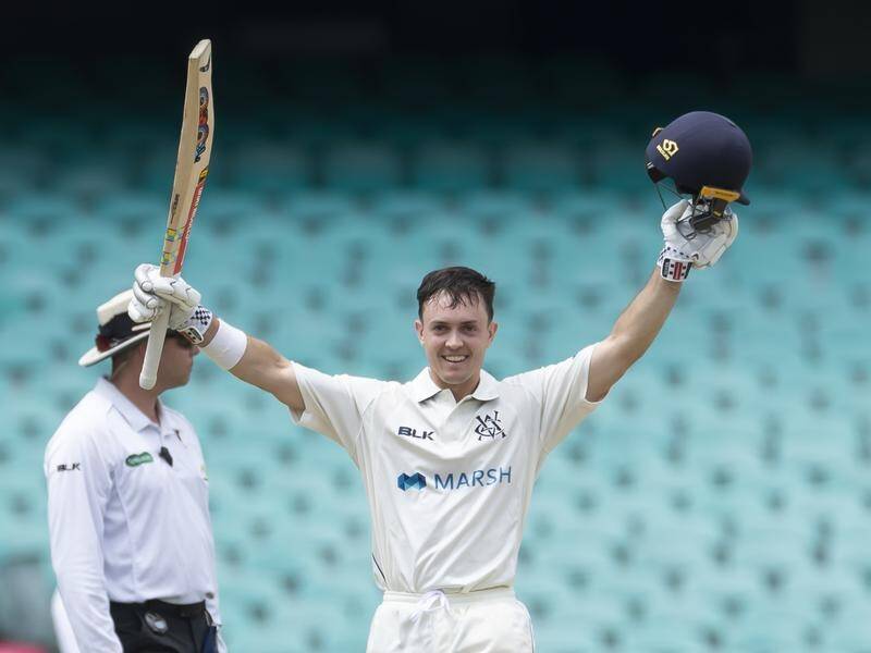 Seb Gotch celebrates scoring his maiden century for Victoria in their Shield match against NSW.