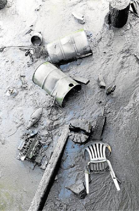 Rubbish dumped under a concrete pier at the end of Lindsay Street, Invermay, includes tyres, cash registers, television sets and car motors. Picture: MARK JESSER