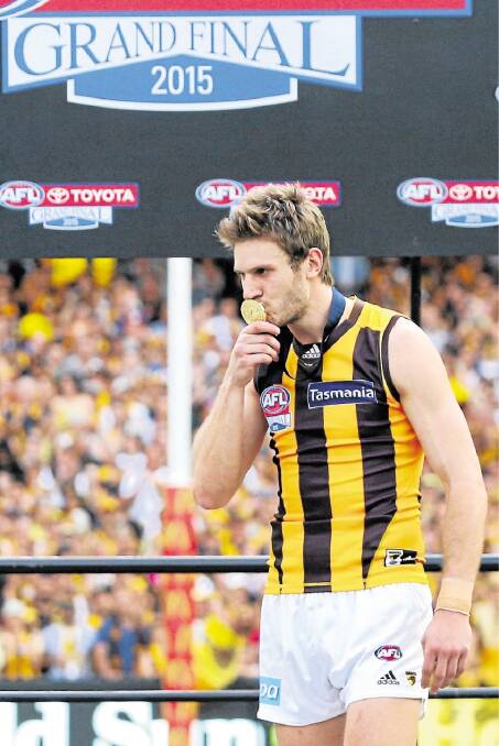  Grant Birchall with his premiership medallion on Saturday. Picture: Getty Images.