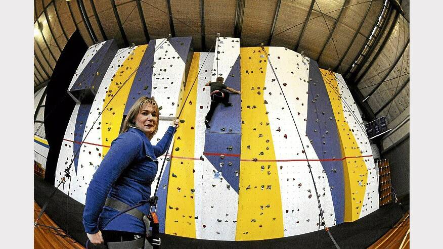 PCYC rockwall instructor Banjo Lockhart tests the wall watched by PCYC adventure and fitness team leader Bec Bailey. Picture: PAUL SCAMBLER