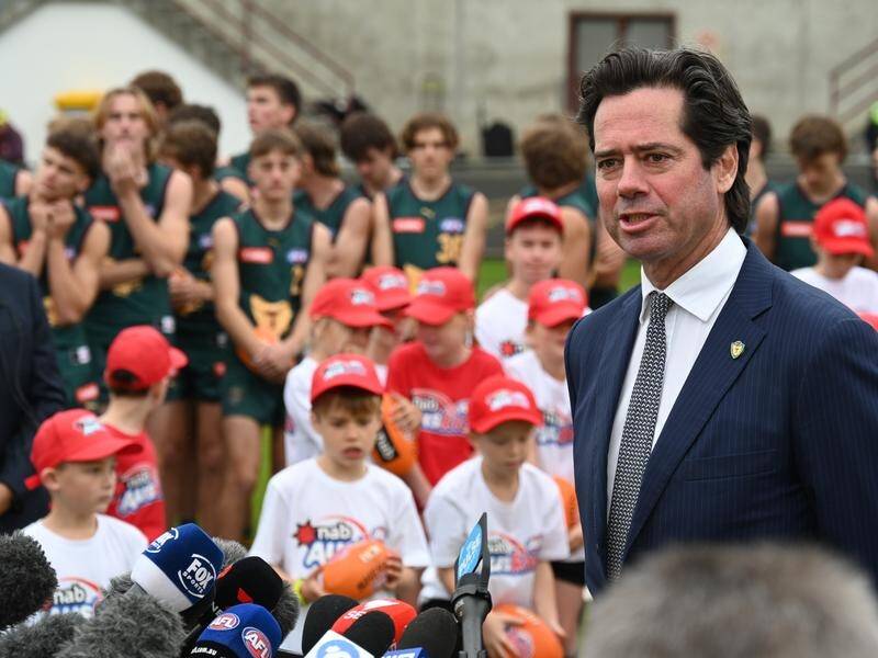 AFL boss Gillon McLachlan is surrounded by footy fans as he announces Tasmania's entry to the AFL. (Loic Le Guilly/AAP PHOTOS)