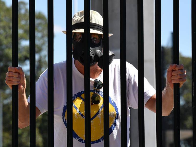 A cricket fan wearing a gas mark to ward off coronavirus got as far as the gates of the SCG.