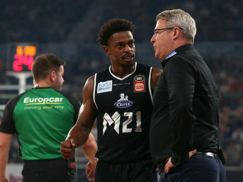 Casper Ware (C) with 23 points has led Melbourne United to a 102-94 NBL home victory over Brisbane.