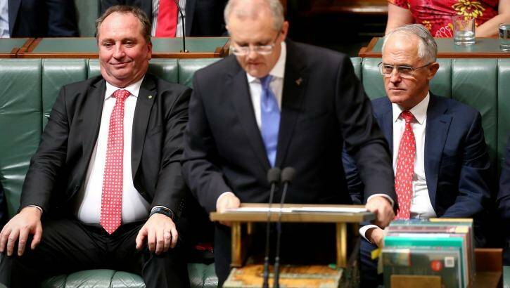 Deputy Prime Minister Barnaby Joyce and Prime Minister Malcolm Turnbull listen as Treasurer Scott Morrison delivers the Budget speech in Canberra in May. Photo: Alex Ellinghausen