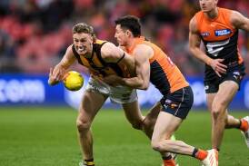 Denver Grainger-Barras (l) has become the third player sidelined after Hawthorn's intra-club hitout. (Steven Markham/AAP PHOTOS)