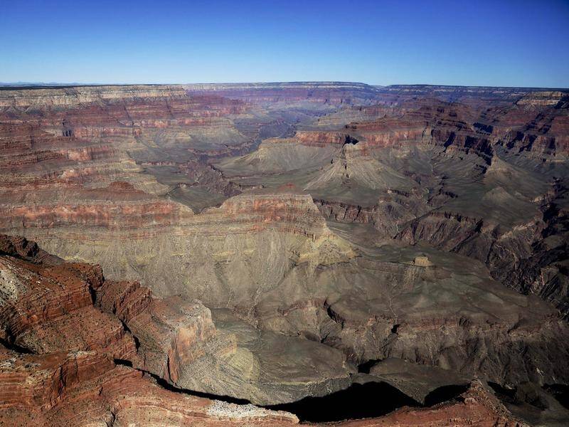 A 77 year old Tasmanian man has drowned swimming in a river at the US Grand Canyon National Park .