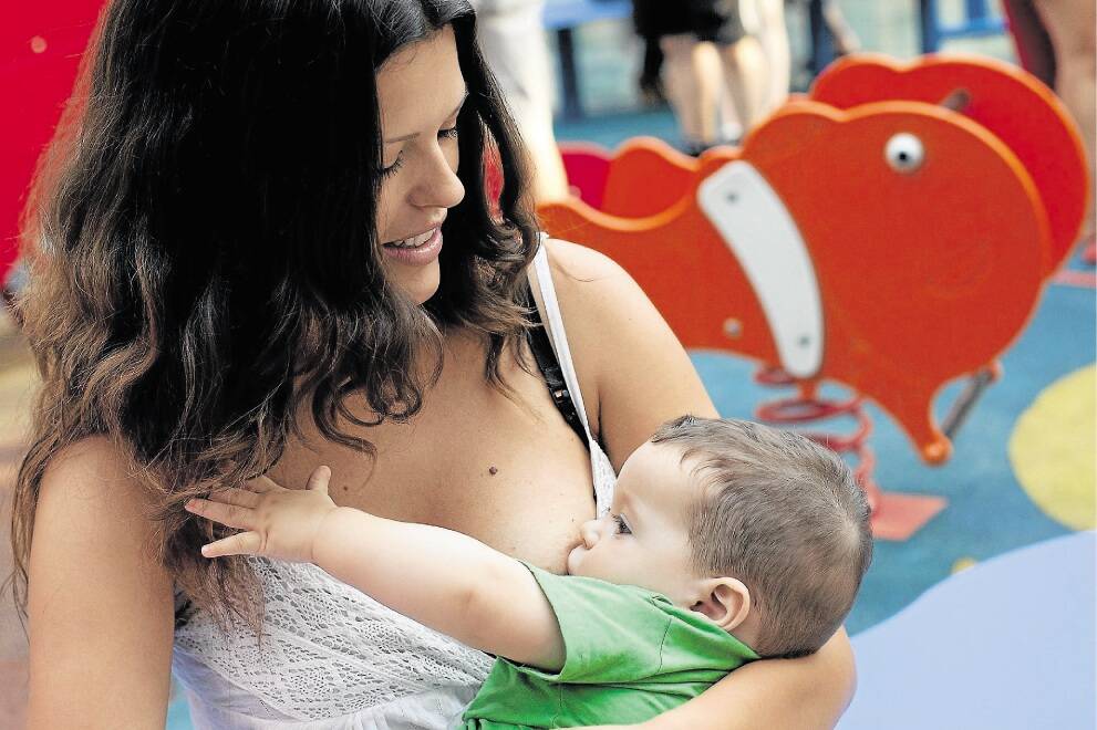 A mother breastfeeds her child during a protest outside a Primark Store on August 23, 2013 in Madrid, Spain. Nursing mothers organized breast feeding protest at Primark Stores across Spain to claim their right to breast feed children at anytime and at anywhere the child needs and stop the prejudice of doing it in public. Organizers say that on August 12, a woman was allegedly asked to leave a Primark Store as she was breast feeding her child.  (Photo by Pablo Blazquez Dominguez/Getty Images)