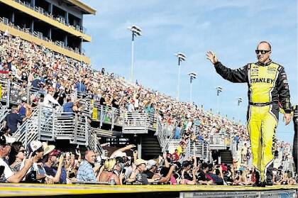 Marcos Ambrose is introduced to the fans before one of his final NASCAR appearances in Miami, Florida last weekend. Picture: GETTY IMAGES