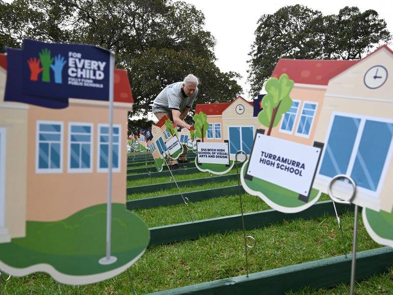 Schoolhouses were placed near NSW parliament in a campaign to highlight underfunding in schools. (Dean Lewins/AAP PHOTOS)