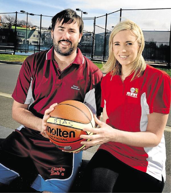 Rebels player Raymond Young and City of Launceston player Alicia Riley ahead of the start of the state basketball league's second season this weekend. Picture: GEOFF ROBSON
