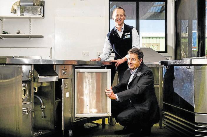 St Michaels Association chief executive John Gilpin and Becks Home Hardware acting area manager Mike Foster with the stainless steel commercial kitchen that Becks is donating to St Michaels. Picture: PHILLIP BIGGS