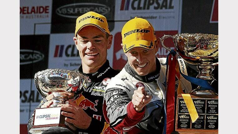 Championship leader Craig Lowndes celebrates with Adelaide race winner James Courtney.  Picture: GETTY IMAGES.