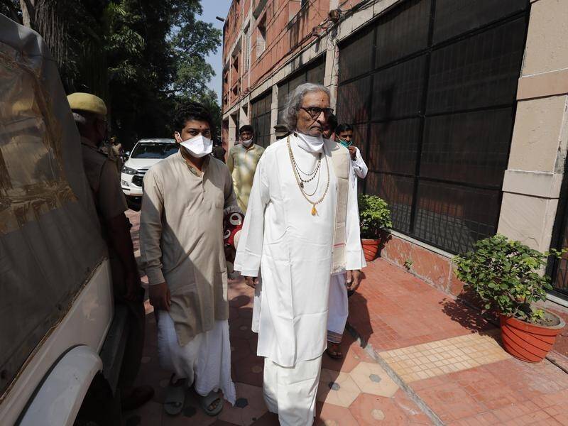 Acharya Dharmendra Dev, one of 32 accused over the Babri Masjid mosque attack, attends court.