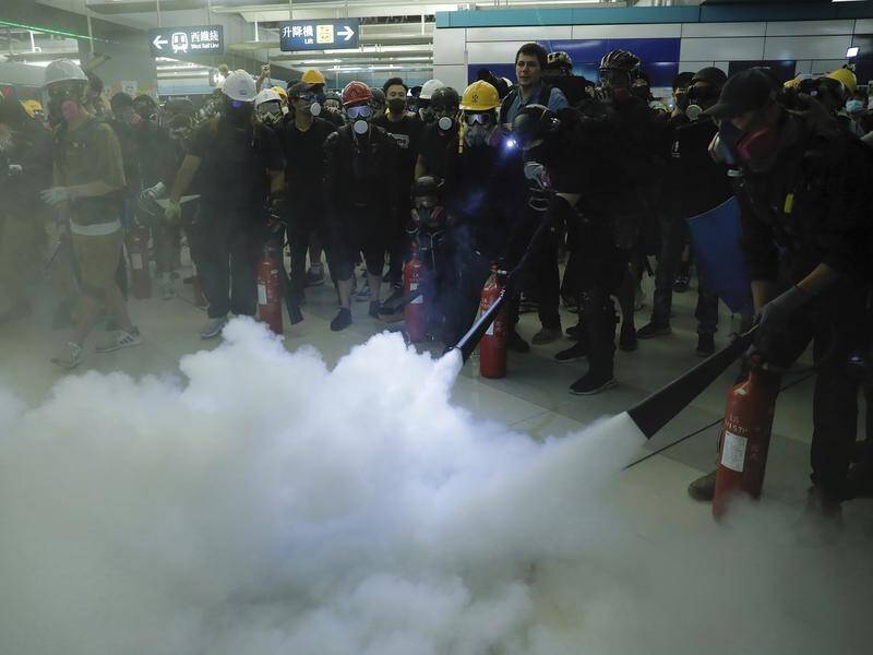 Protesters sprayed fire extinguishers during a demonstration at a Hong Kong subway station.