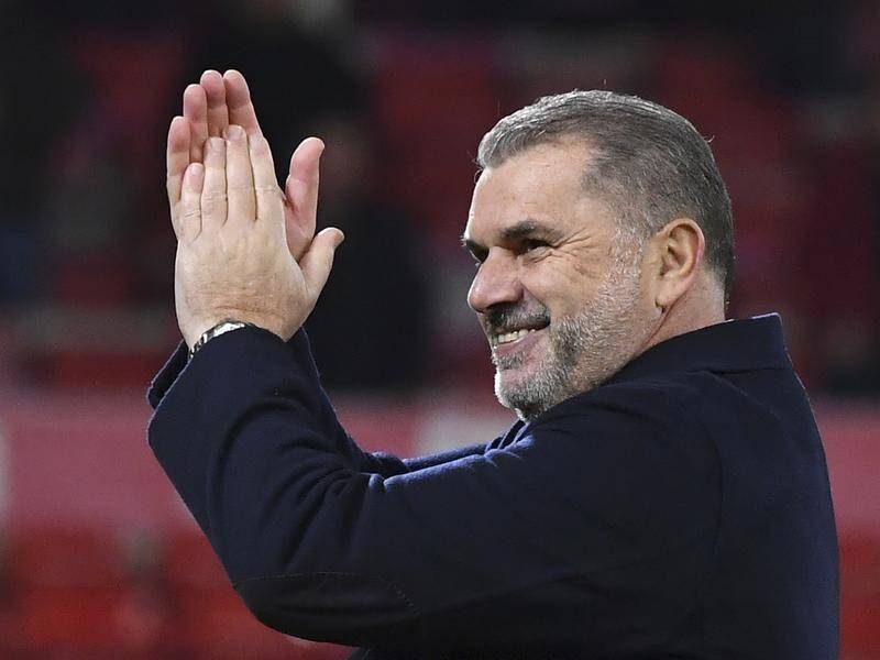 Ange Postecoglou has given - and received - joy from meeting Spurs fans with Down Syndrome. (AP PHOTO)