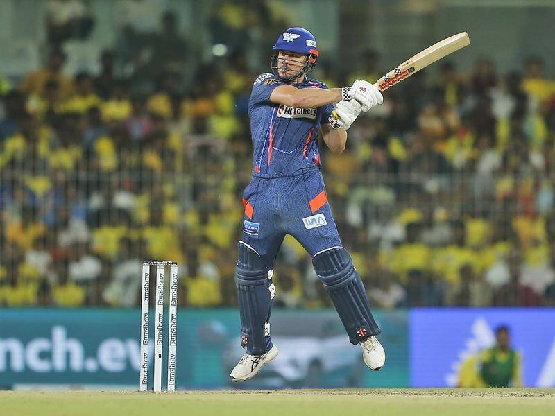 Marcus Stoinis cuts for four during his magnificent 124 not out for Lucknow Super Giants in the IPL. (AP PHOTO)