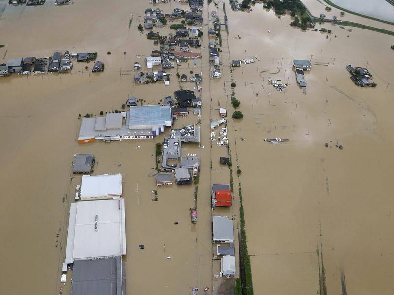 Heavy rains and floods in southern Japan have killed two and forced the evacuation of thousands.