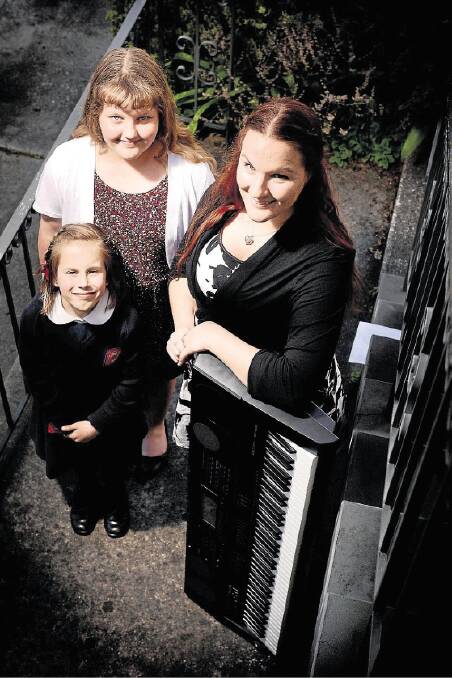 Pianist Amy Johnson, 8, vocalist Jorjah Sigtenhorst, 10, and tutor Catherine Byers are gearing up for the St Cecilia performance challenge. Picture: SCOTT GELSTON