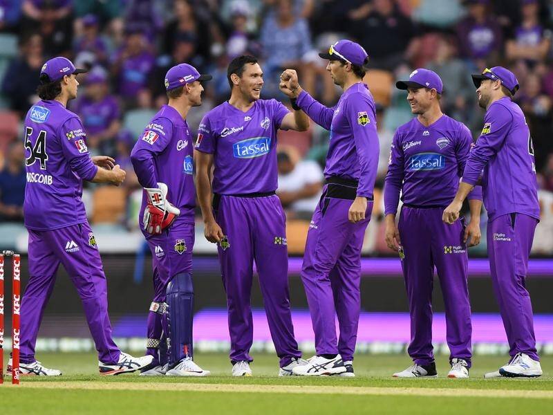 The Hurricanes celebrate their fifth win of the season, a 21-run triumph over the Stars in Hobart.