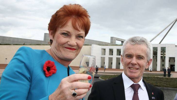 Senator Pauline Hanson is seen here toasting Donald Trump's victory with Senator Malcolm Roberts. Photo: Alex Ellinghausen