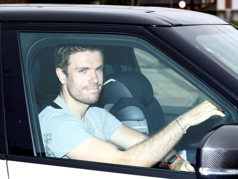 Liverpool's Jordan Henderson leaves the club's training ground after players returned on Thursday.