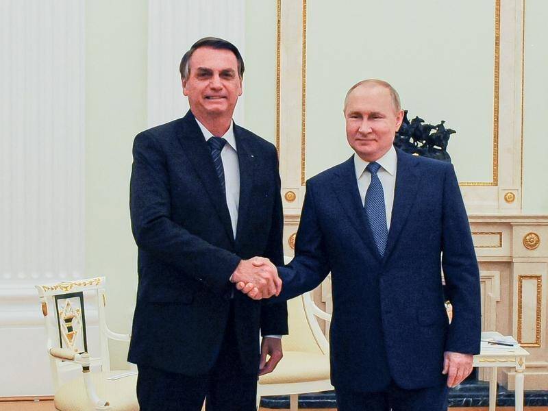 Jair Bolsonaro (l) says he spoke for two hours with Russian leader Vladimir Putin at the weekend.